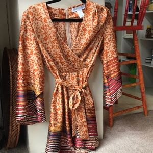 A beautiful, elegant orangish to red and blue top